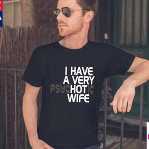 May include: Black t-shirt with white text that reads "I have a very psychotic wife".