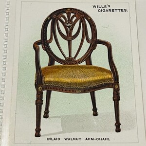 May include: A vintage Wills's Cigarettes advertisement featuring an inlaid walnut arm-chair with a gold-colored seat cushion.