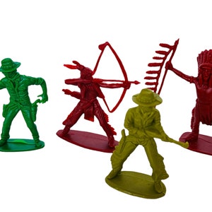 May include: Set of four plastic toy figures depicting cowboys and Native Americans. The figures are green, red, and yellow and are posed in action stances. The cowboys are holding guns and the Native Americans are holding bows and arrows.