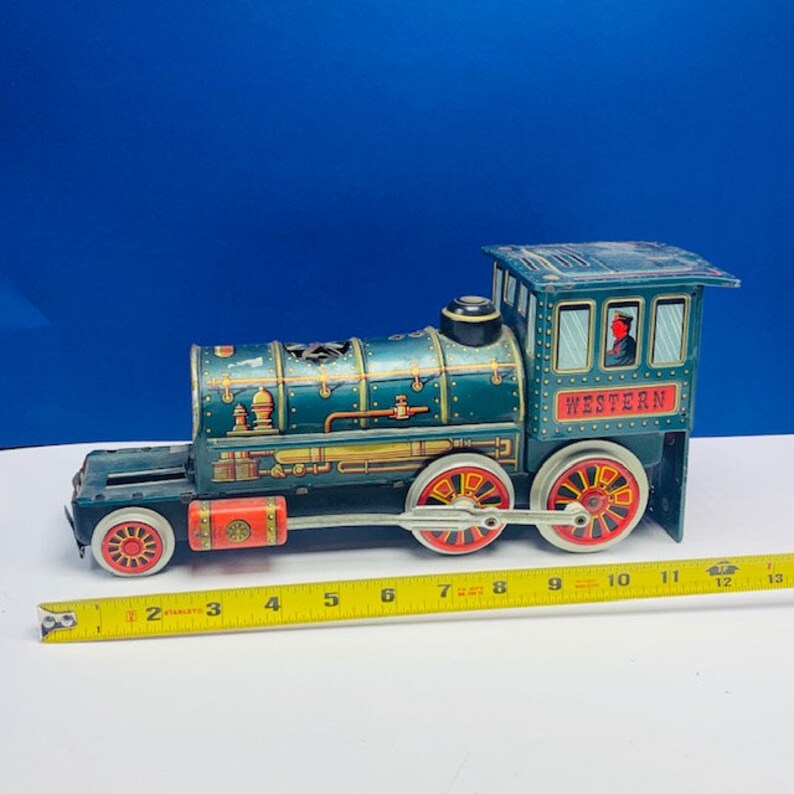 WESTERN TRAIN JAPAN Modern Toys tin litho battery operated vintage 1960s locomotive engine green gold vtg mcm trademark trade mark