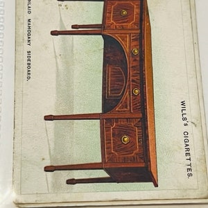 May include: A vintage advertisement for Wills's Cigarettes featuring a detailed illustration of an inlaid mahogany sideboard. The text "INLAID MAHOGANY SIDEBOARD" is printed on the left side of the image, and "WILLS'S CIGARETTES" is printed on the right side.