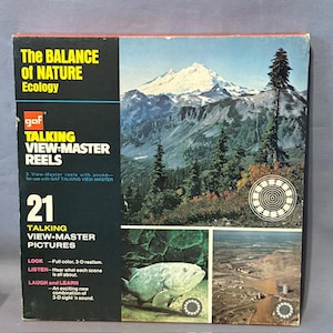 May include: A vintage GAF Talking View-Master Reels box with the text "The Balance of Nature Ecology." The box shows a mountain landscape with trees and a circular design. It contains 21 talking view-master pictures with 3-D realism.