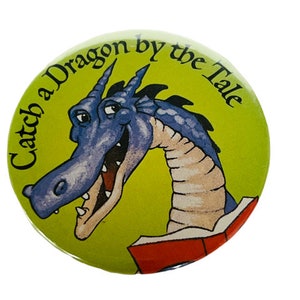 Catch Dragon By Tale Button vtg Pinback anthropomorphic pin book purple monster