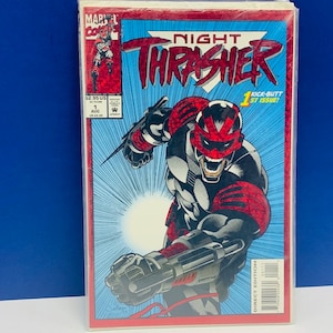 May include: A comic book titled "Night Thrasher" with a Direct Edition label. The cover features a superhero in a red and black helmet and armor, with a weapon. The background is blue with the title in large white letters.