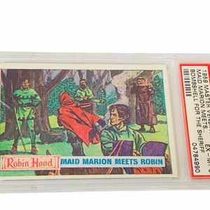 May include: A vintage trading card featuring a colorful illustration of Robin Hood and Maid Marian in a forest setting. The card is titled "Robin Hood" and "Maid Marion Meets Robin". The card is graded "EX-MT 6" by PSA.