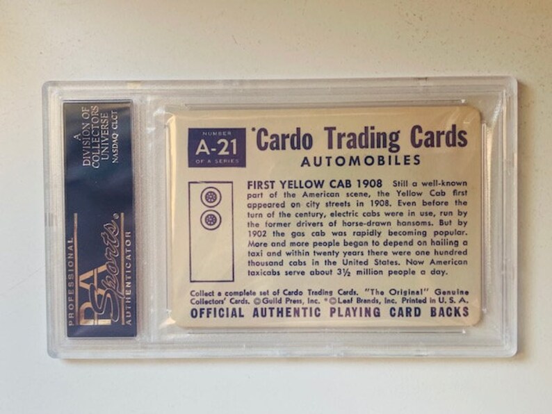 May include: A vintage trading card featuring a yellow taxi cab. The card is from the Cardo Trading Cards series, number A-21, and is titled "First Yellow Cab 1908". The card describes the history of the yellow taxi cab in the United States.