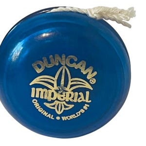 May include: A blue Duncan Imperial yo-yo with a gold logo and the text "Original World's #1".