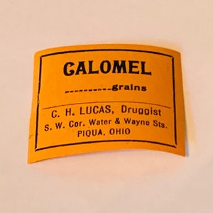 May include: A yellow label with black text that reads "CALOMEL .......grains C. H. LUCAS, Druggist S. W. Cor. Water & Wayne Sts. PIQUA, OHIO"