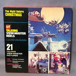 May include: A vintage "The Night Before Christmas" GAF Talking View-Master Reels box. The box features a colourful illustration of Santa's sleigh and reindeer, with additional scenes. The box includes the text "21 Talking View-Master Pictures."