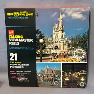 May include: A vintage GAF Talking View-Master Reels box, showcasing Walt Disney World's Magic Kingdom. The box contains 21 talking View-Master pictures with full colour and 3-D realism. The box features images of Cinderella's castle and other park attractions.