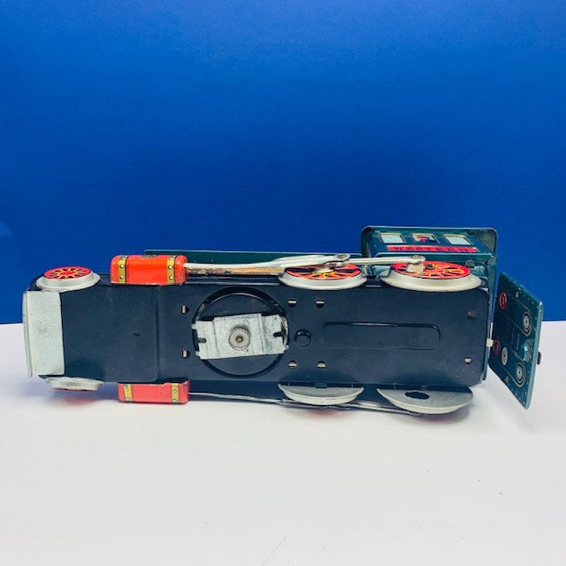 WESTERN TRAIN JAPAN Modern Toys tin litho battery operated vintage 1960s locomotive engine green gold vtg mcm trademark trade mark