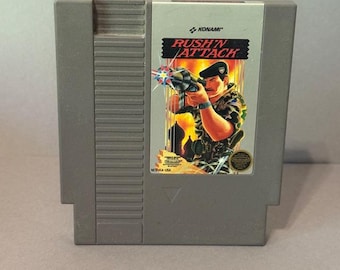 Cartucho de videojuego vintage de Nintendo (NES, Japón, 1985, Rush N' Attack, Konami)