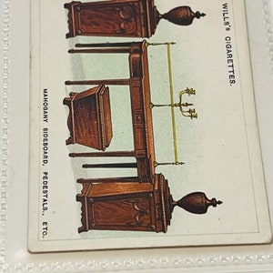May include: A vintage illustration of a mahogany sideboard, pedestals, and other furniture pieces. The image is from a Wills's Cigarettes advertisement.