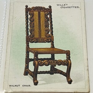 May include: A vintage Wills's Cigarettes advertisement featuring a walnut chair with intricate carvings and a woven seat. The chair has a tall, carved back and twisted legs. The text "Wills's Cigarettes" and "Walnut Chair" are printed below the image.