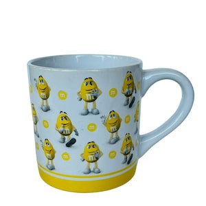 M&Ms Coffee Mug Cup Yellow Frankford Candy Mars movie theater cartoon animation