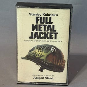 May include: A Full Metal Jacket cassette tape. The cover features the film's title in bold black letters, with a helmet illustration that reads "Born to Kill." The original motion picture soundtrack is also noted.