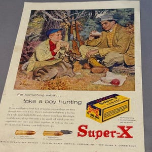 May include: Vintage advertisement featuring a father and son enjoying a picnic while hunting. The ad promotes Super-X 22 Long Rifle ammunition. The image includes text that reads "take a boy hunting".