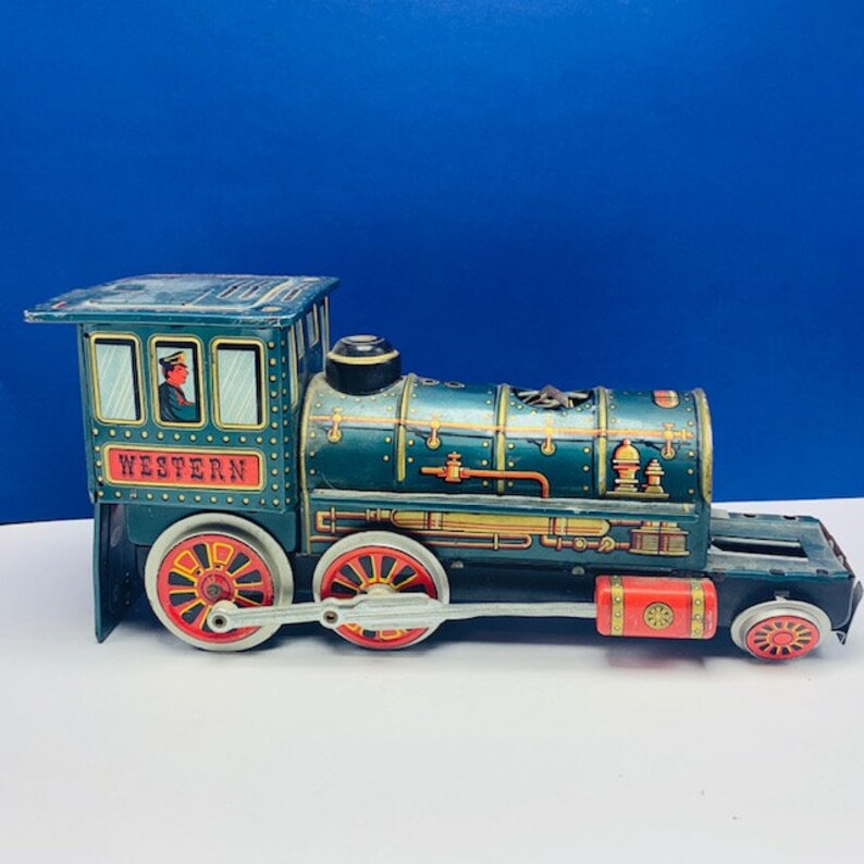 WESTERN TRAIN JAPAN Modern Toys tin litho battery operated vintage 1960s locomotive engine green gold vtg mcm trademark trade mark