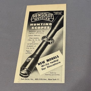 May include: An advertisement for Hensoldt Wetzlar hunting scopes. The ad features a detailed illustration of a scope, with text highlighting features like balanced optics and variable power. The ad also includes the text "NEW MODELS Write today for literature."