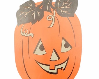 May include: Orange, smiling jack-o'-lantern decoration with black and grey leaves and stem. The pumpkin has triangular eyes and a toothy grin. A classic Halloween decoration.