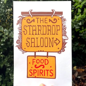 STARDROP SALOON PRINT, stardew valley print, stardew valley art, cottagecore, stardew valley, stardrop saloon print, linocut, switch game