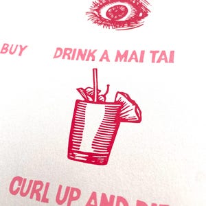 May include: A white background with pink text and illustrations. The text includes "GET POKED IN THE EYE", "DRINK A MAI TAI", and "CURL UP AND DIE". Illustrations include an eye and a cocktail.