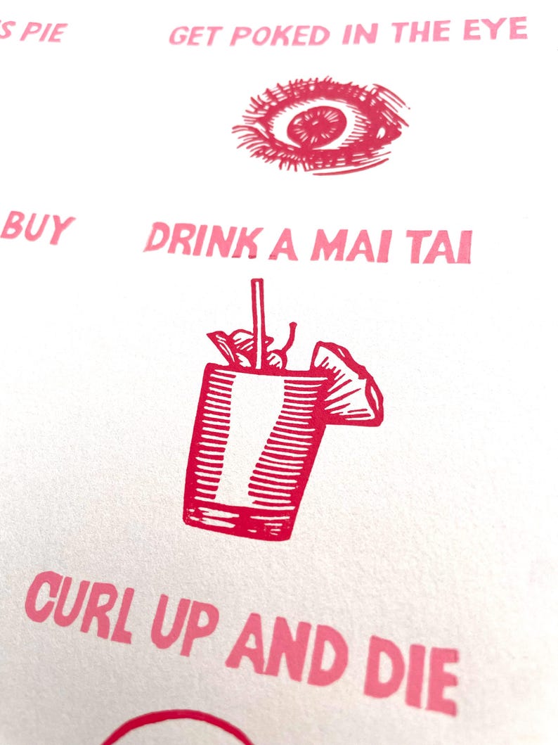 May include: A white background with pink text and illustrations. The text includes "GET POKED IN THE EYE", "DRINK A MAI TAI", and "CURL UP AND DIE". Illustrations include an eye and a cocktail.