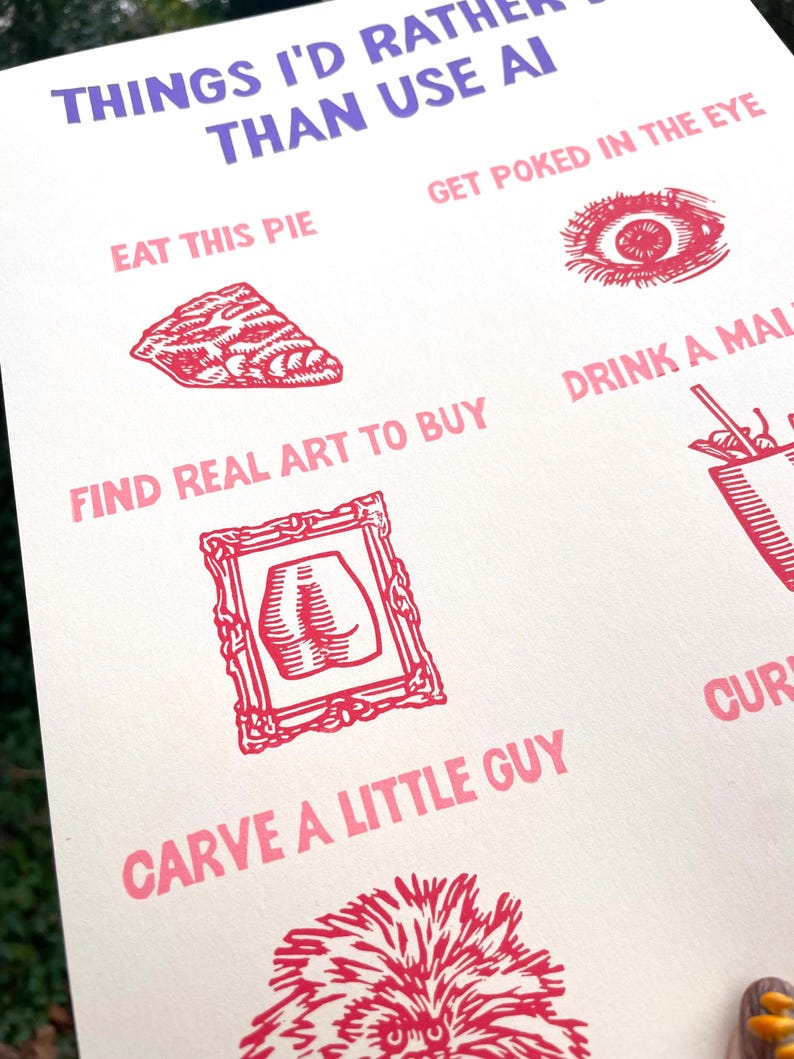 May include: A white poster with the text "THINGS I'D RATHER THAN USE AI" in purple and pink. The poster features illustrations and phrases like "EAT THIS PIE" and "FIND REAL ART TO BUY" in pink, with corresponding red illustrations.