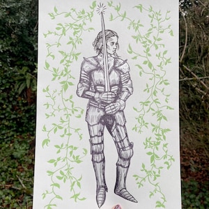 May include: A black and white illustration of a woman in armour holding a sword. The background is a light green with a vine pattern.