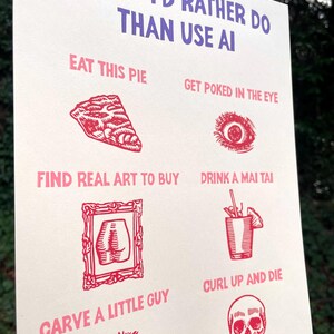 May include: A cream-colored poster with red and purple text and illustrations. The text reads "THINGS I'D RATHER DO THAN USE AI." The illustrations include a slice of pie, an eye, a framed butt, a cocktail, a skull, and more.