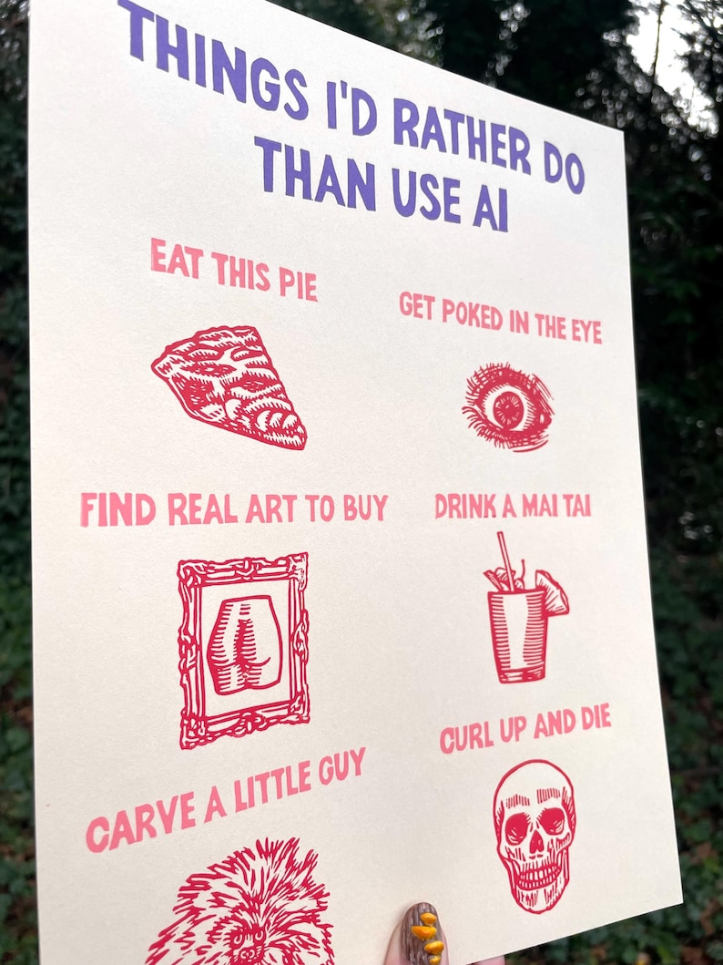 May include: A cream-colored poster with red and purple text and illustrations. The text reads "THINGS I'D RATHER DO THAN USE AI." The illustrations include a slice of pie, an eye, a framed butt, a cocktail, a skull, and more.