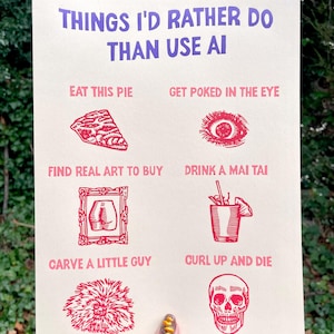 May include: A beige print with red illustrations and text that reads "THINGS I'D RATHER DO THAN USE AI." The print features images of a pie slice, an eye, art, a cocktail, a carving, and a skull.