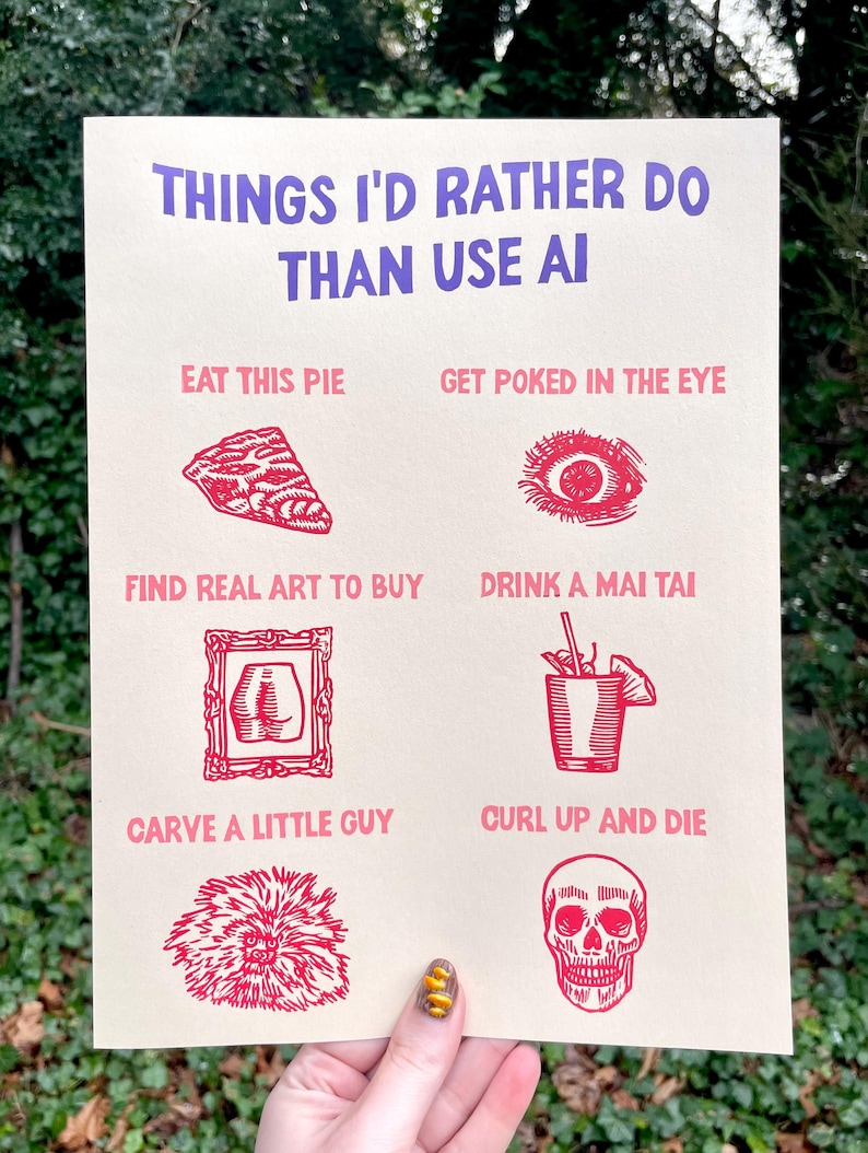 May include: A beige print with red illustrations and text that reads "THINGS I'D RATHER DO THAN USE AI." The print features images of a pie slice, an eye, art, a cocktail, a carving, and a skull.