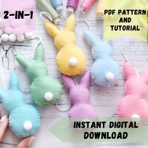 May include: A set of six felt bunny decorations in various pastel colours, including pink, blue, green, and yellow. Each bunny has a white pom-pom tail and a string for hanging. The image includes the text "2-IN-1 PDF PATTERN AND TUTORIAL INSTANT DIGITAL DOWNLOAD".