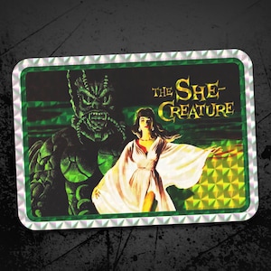 The She-Creature Prism Sticker Retro Sci-Fi Holographic Decal, Vintage Movie Poster Collectible, Spooky Pop Culture, 80s Aesthetic