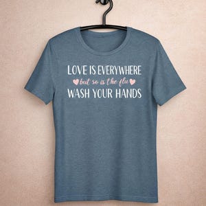 Funny nurse shirt love is everywhere but so is the flu wash your hands design on blue bella canvas tee