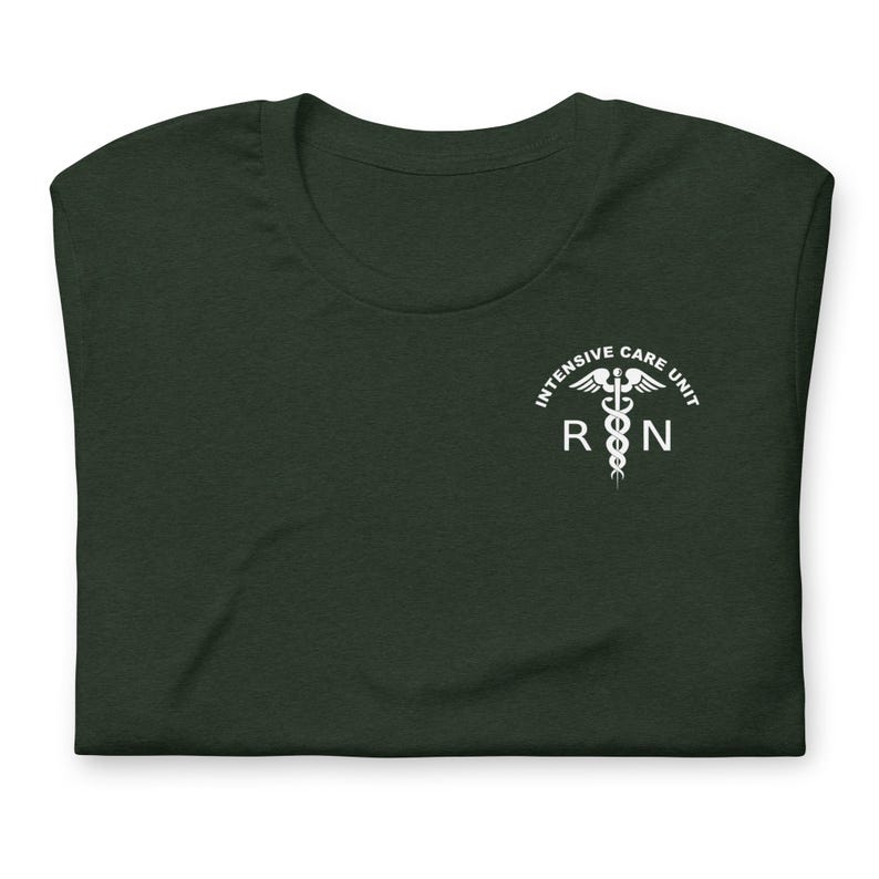 Folded forest green ICU nurse shirt with white critical care RN left-chest design.