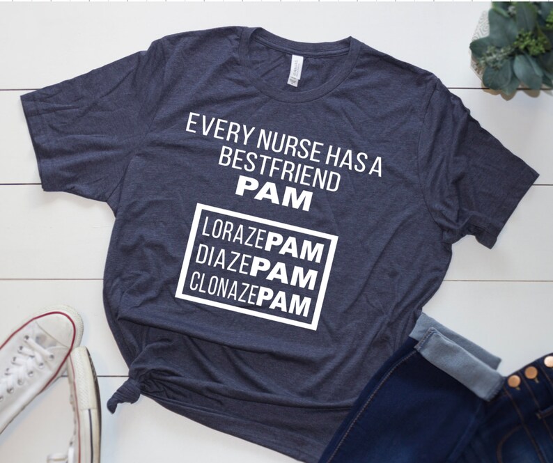 May include: A dark blue t-shirt with white text that reads "Every nurse has a best friend PAM Lorazepam Diazepam Clonazepam".