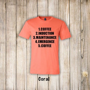 May include: Coral t-shirt with black text that reads "1. COFFEE 2. INDUCTION 3. MAINTENANCE 4. EMERGENCE 5. COFFEE"