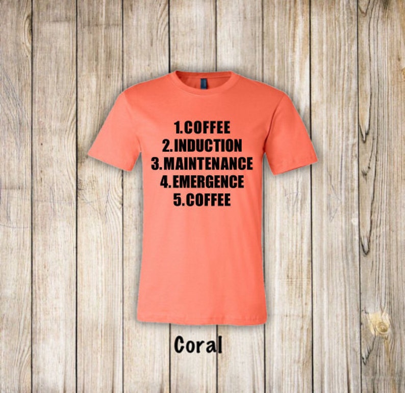 May include: Coral t-shirt with black text that reads "1. COFFEE 2. INDUCTION 3. MAINTENANCE 4. EMERGENCE 5. COFFEE"