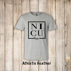 May include: A gray t-shirt with the text "NICU Nurse" in a black square.