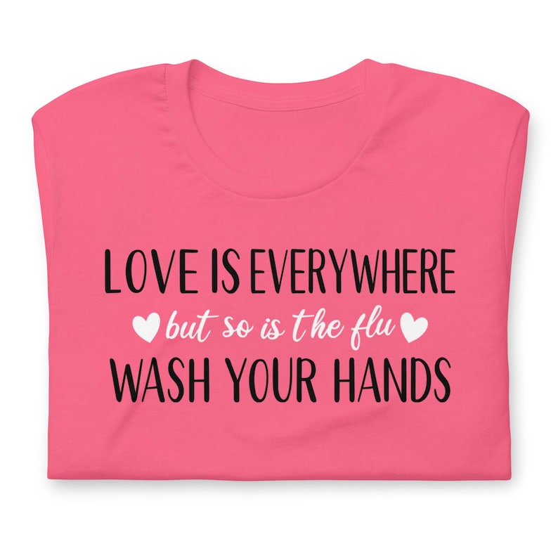 Funny nurse gift shirt love is everywhere design on bright pink RN shirt