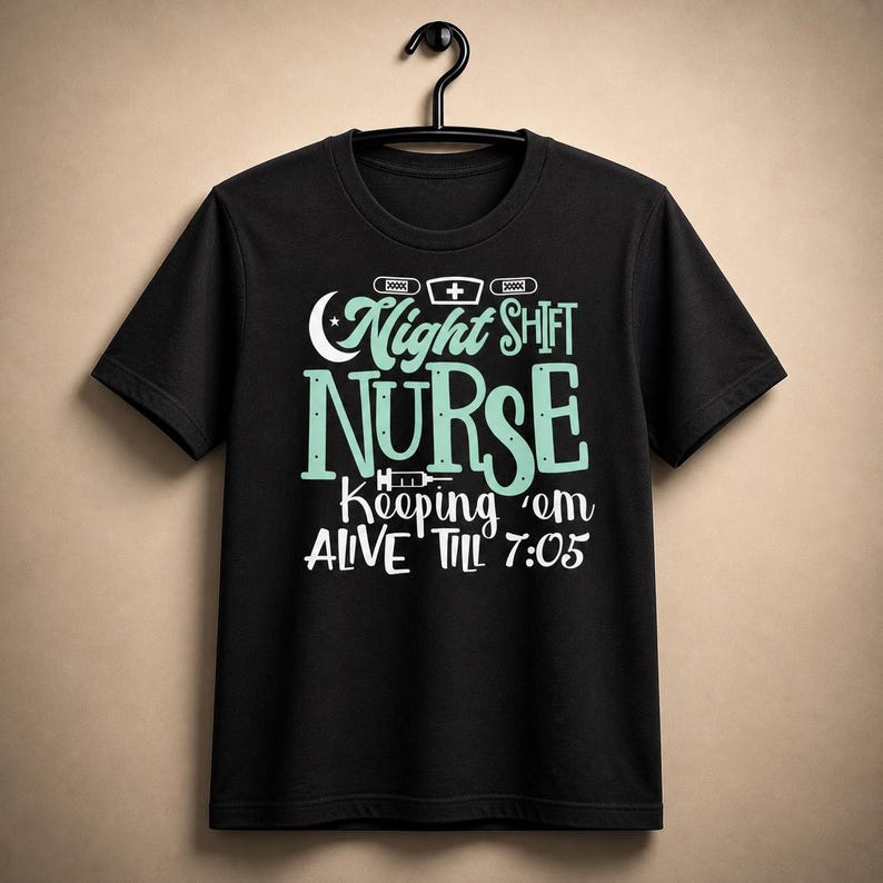 Night shift nurse shirt funny RN tee black Bella Canvas 3001 overnight nurse graphic shirt hanging neutral background