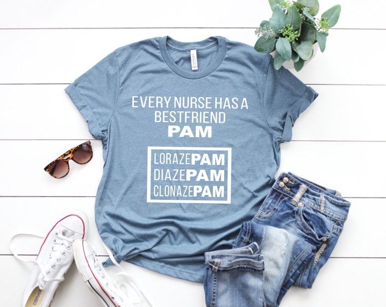May include: A blue t-shirt with the text "Every nurse has a best friend PAM Lorazepam Diazepam Clonazepam" printed on it.