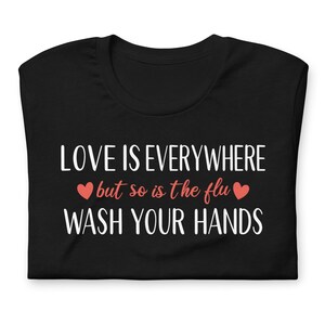 Funny nurse humor shirt love is everywhere but so is the flu design on black tee