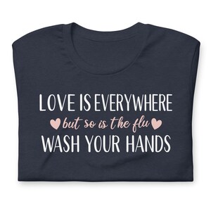 Funny nurse gift shirt love is everywhere design on navy blue RN shirt