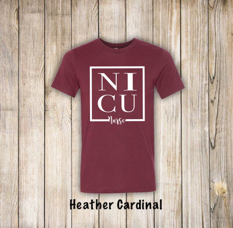 May include: A maroon t-shirt with a white square that says "NICU Nurse" in all caps.