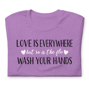 Funny nurse shirt love is everywhere design on purple healthcare worker shirt