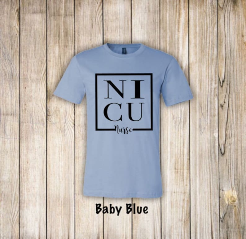 May include: A baby blue t-shirt with a black square that says "NICU Nurse" on it.