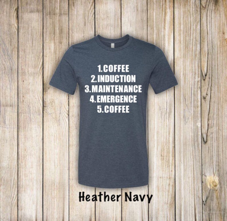 May include: A heather navy blue t-shirt with white text that reads "1. Coffee 2. Induction 3. Maintenance 4. Emergence 5. Coffee".